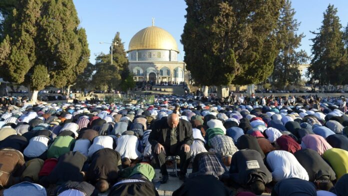 Praying Muslims face Mecca